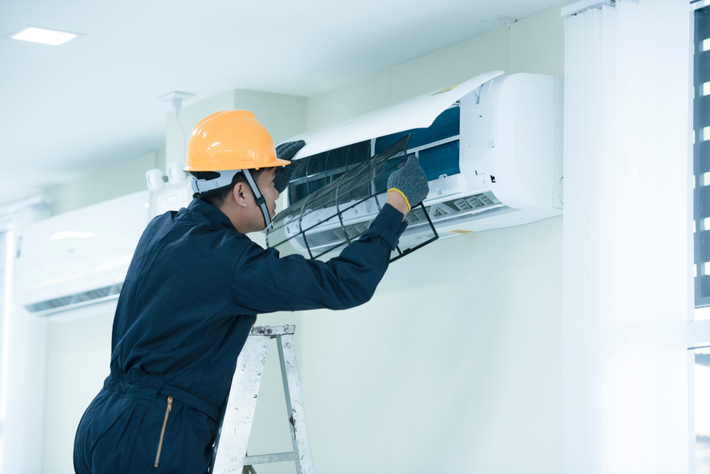 air,conditioning,repairman,on,the,wall,in,the,office