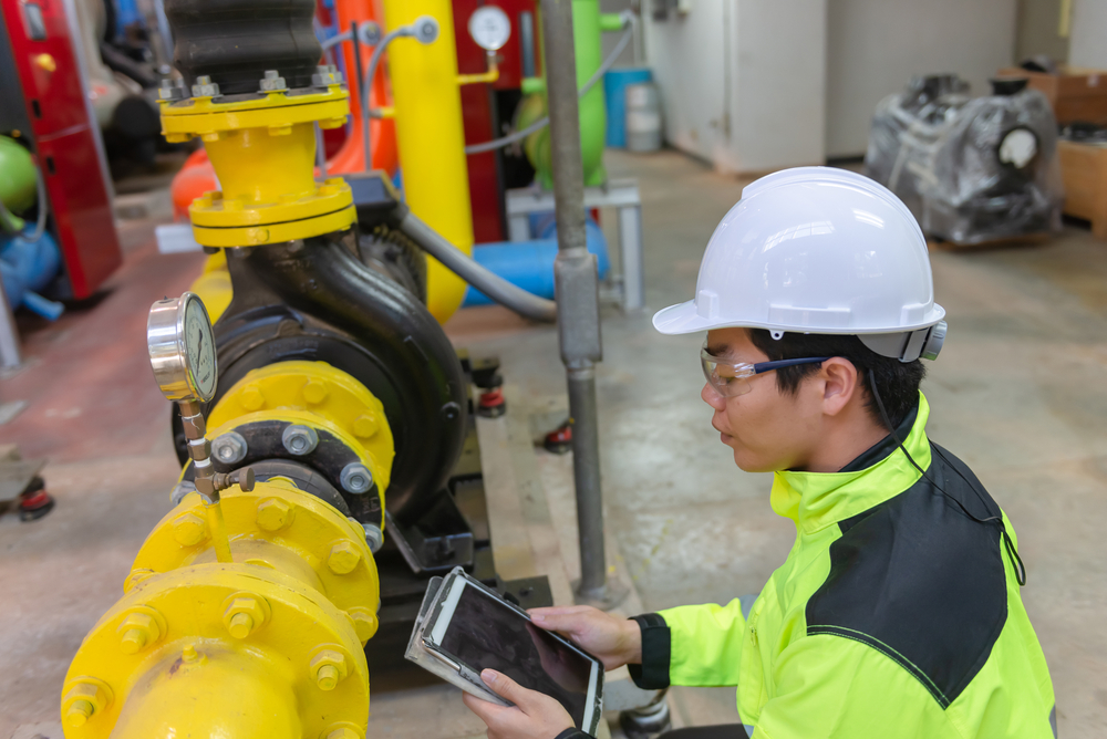 asian,engineer,wearing,glasses,working,in,the,boiler,room,maintenance,checking